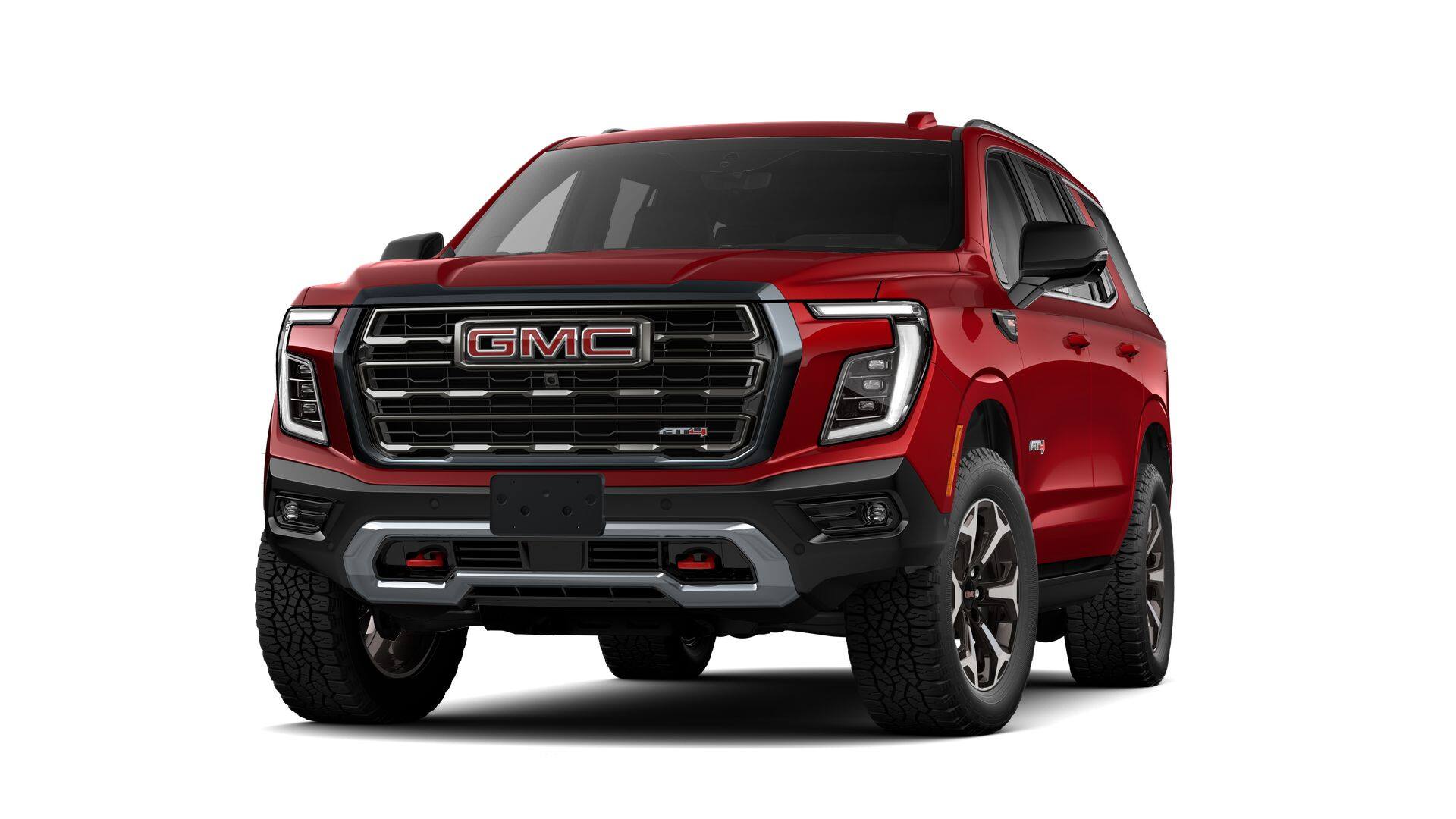2026 GMC Yukon AT4 Ultimate in Volcanic Red Tintcoat — front three-quarter view