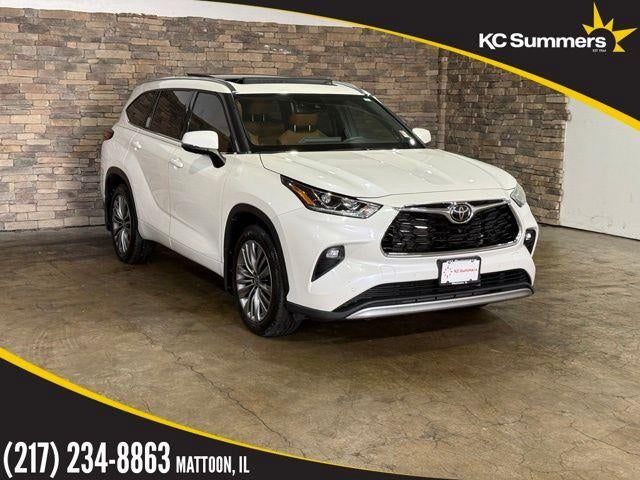 2021 Toyota Highlander Platinum in White — front three-quarter view